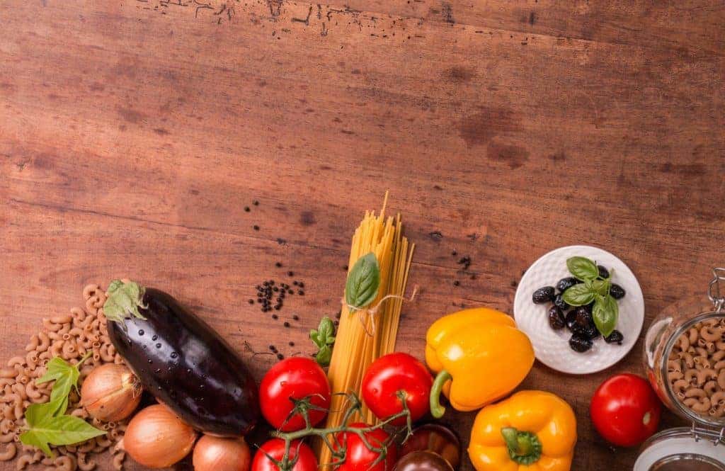 Vegetables and assorted food items on table