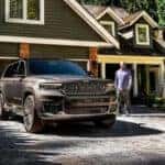 Gray Jeep Grand Cherokee parked in driveway