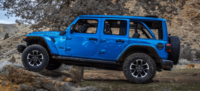 Blue 2025 Jeep Wrangler 4xe Rubicon driving off-road