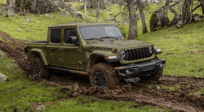 Green 2025 Jeep Gladiator Rubicon driving in mud