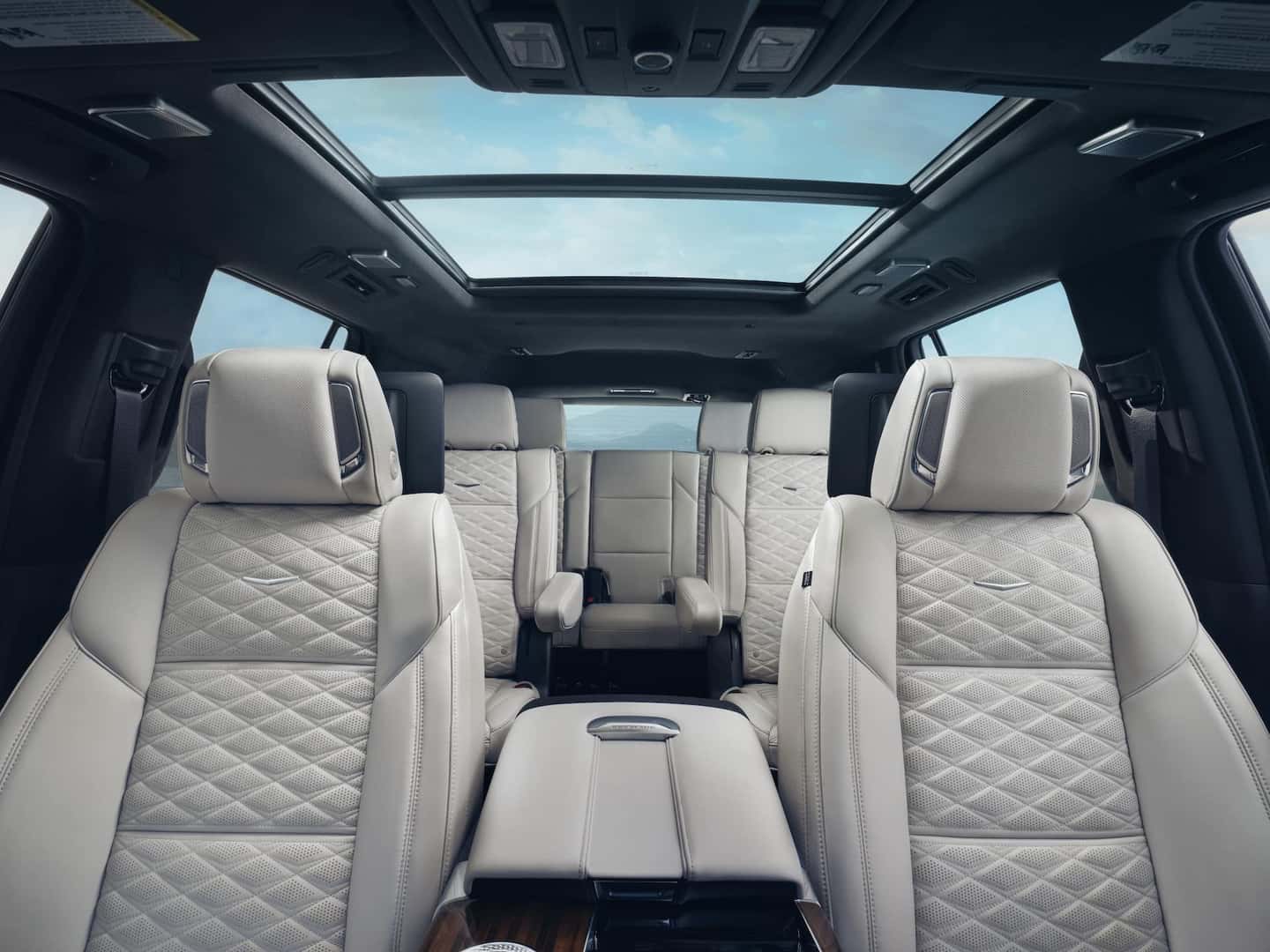 Interior view of the 2025 Cadillac Escalade Sport Platinum from front of vehicle looking through to back of vehicle showing three rows of seating.
