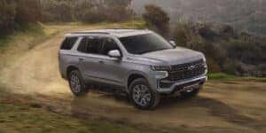 2023 Chevy Tahoe offroading up a hill in silver