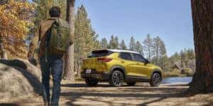 Yellow 2023 Chevy Trailblazer parked at a campsite