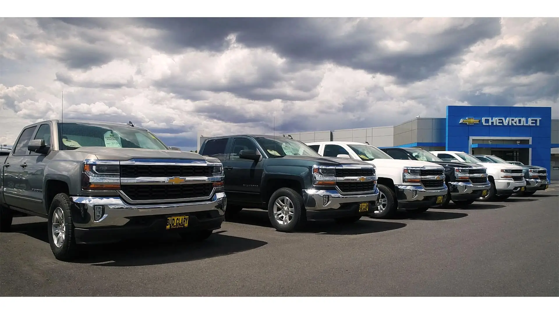 New Chevy Silverados parked outside Bud Clary Chevrolet in Longview, WA