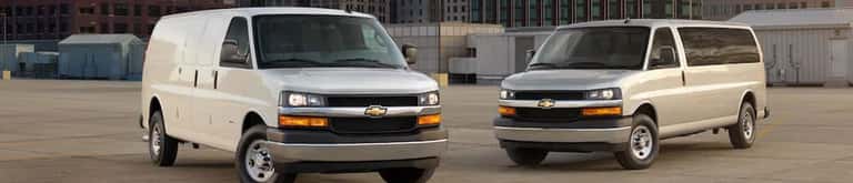 Chevy Express Vans parked