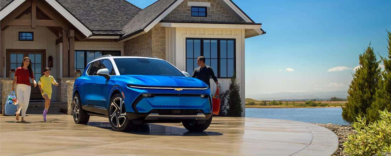 Family walking out to a Chevy Equinox EV