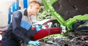 Honda technician working on engine