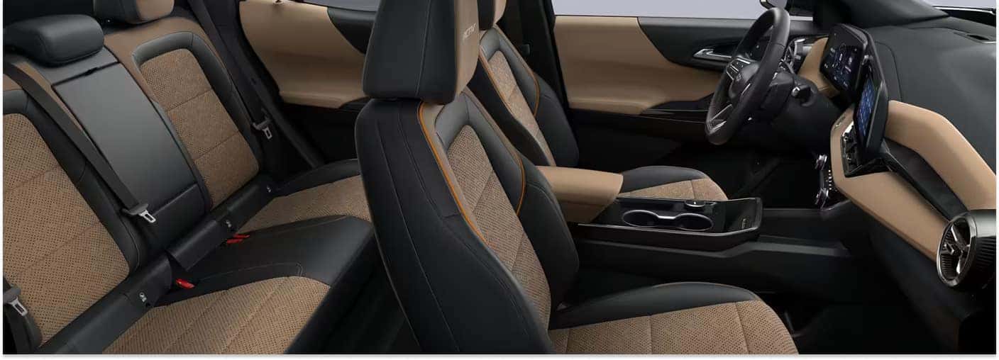 Two-tone black and tan interior cabin of a 2026 Chevrolet Equinox showing front and rear seating.