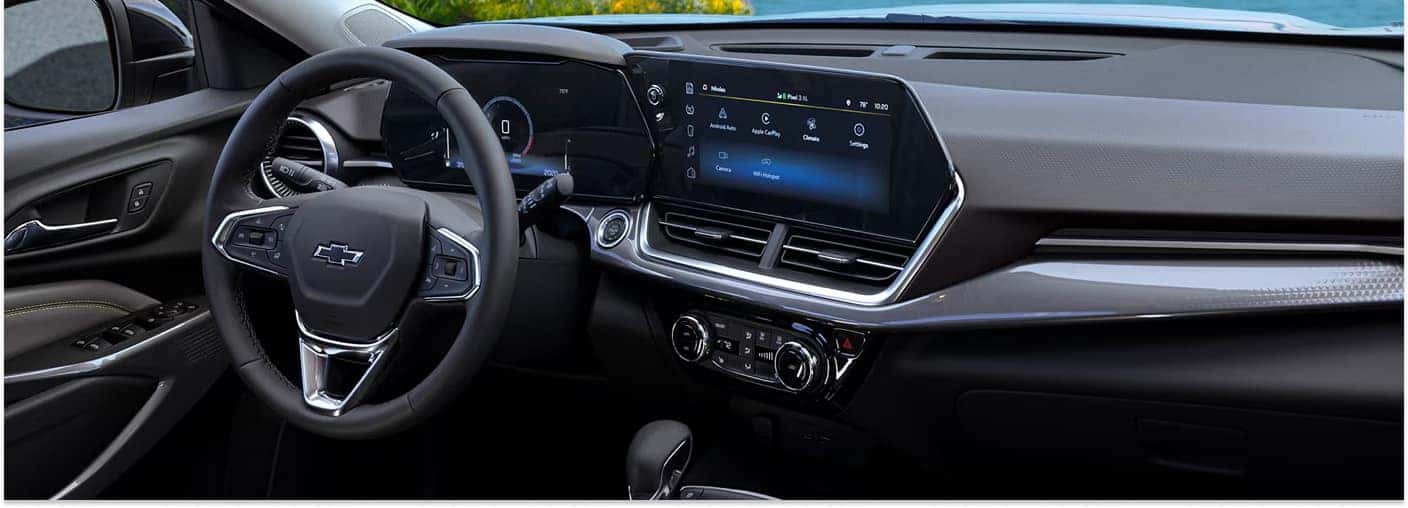 Interior dashboard view of a 2026 Chevrolet Trax featuring a digital display, central touchscreen, and steering wheel.