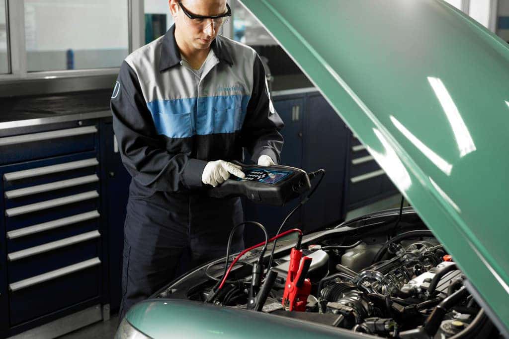 Honda mechanics working in service bay