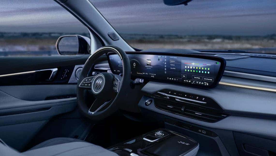Interior of the 2026 Buick Enclave showing the new 30-inch curved display, leather seats, and premium finishes
