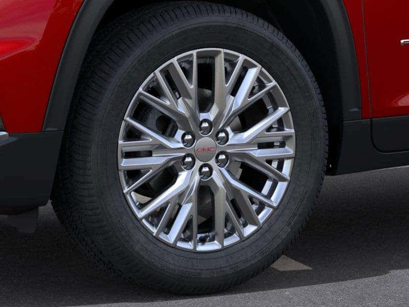 Close-up of 2025 GMC Acadia alloy wheel showcasing bold and athletic styling