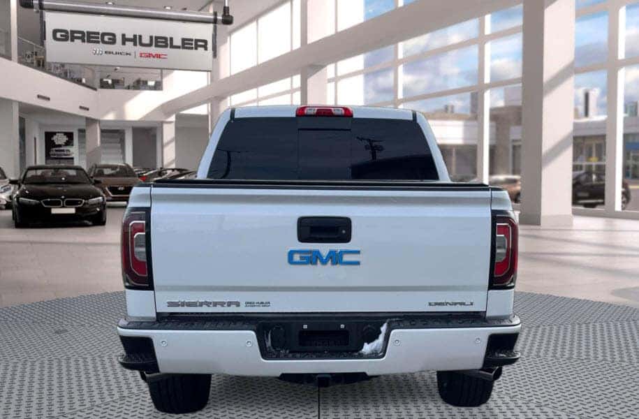Rear view of a used GMC Sierra 1500 inside the Greg Hubler Buick GMC showroom