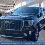 Used GMC Yukon SUV showcased inside Greg Hubler Buick GMC dealership in Marion IN