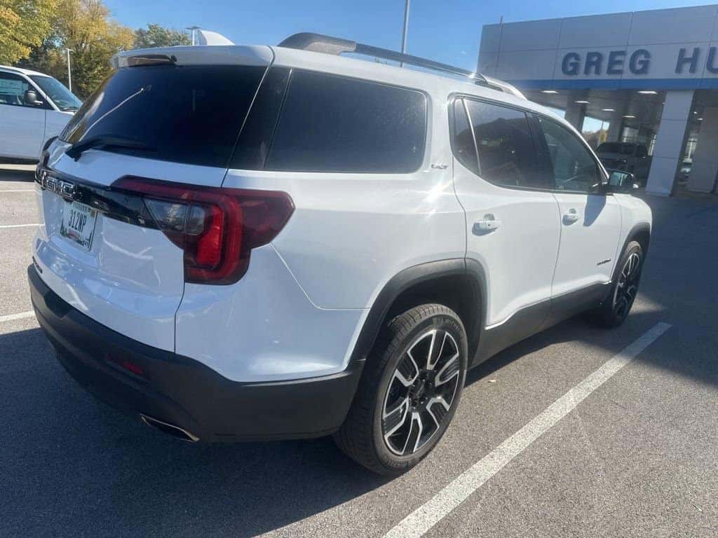 Used GMC Acadia SUV parked outside Greg Hubler Buick GMC dealership in Marion IN