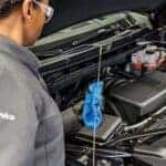 Certified technician performing mid winter inspection for Buick GMC vehicles.