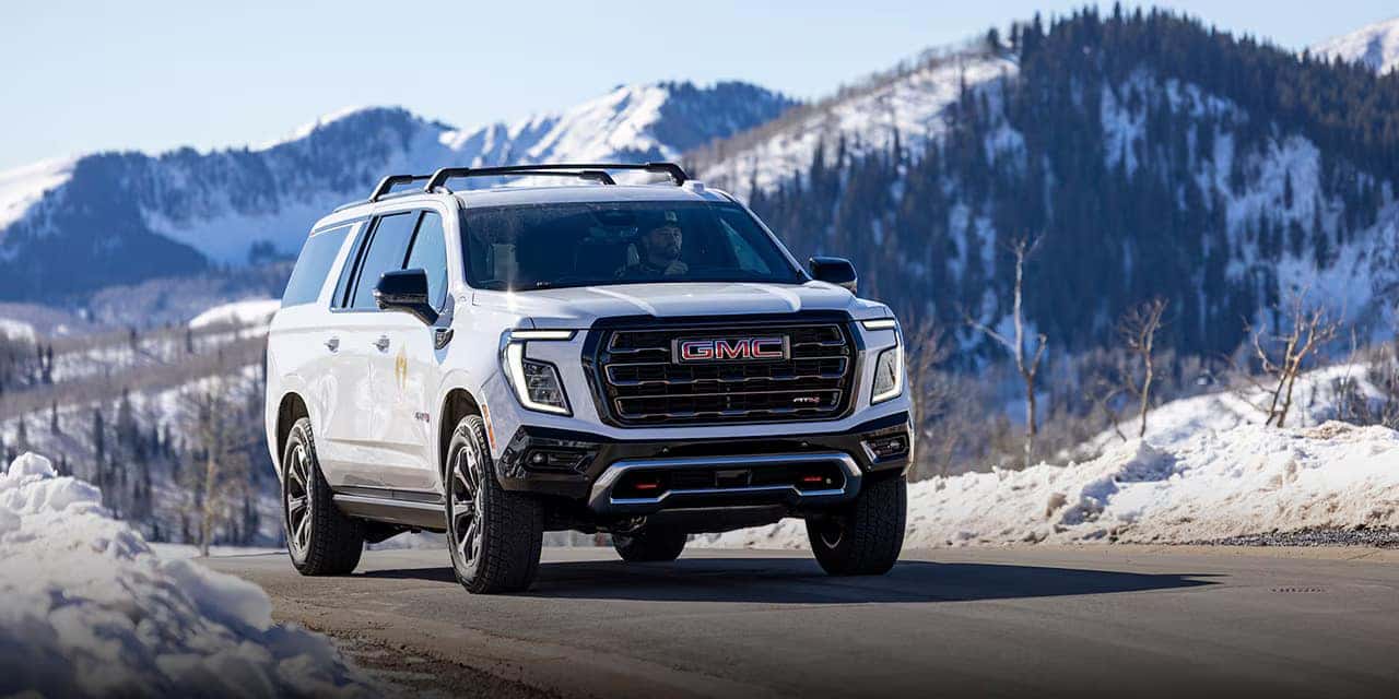 2026 GMC Yukon AT4 driving through heavy snow