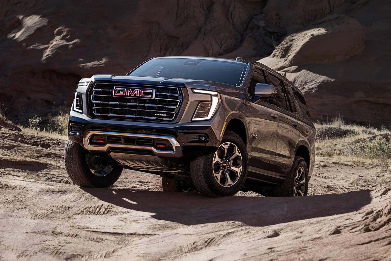 Close up of 2026 GMC Yukon AT4 front skid plates and high approach angle
