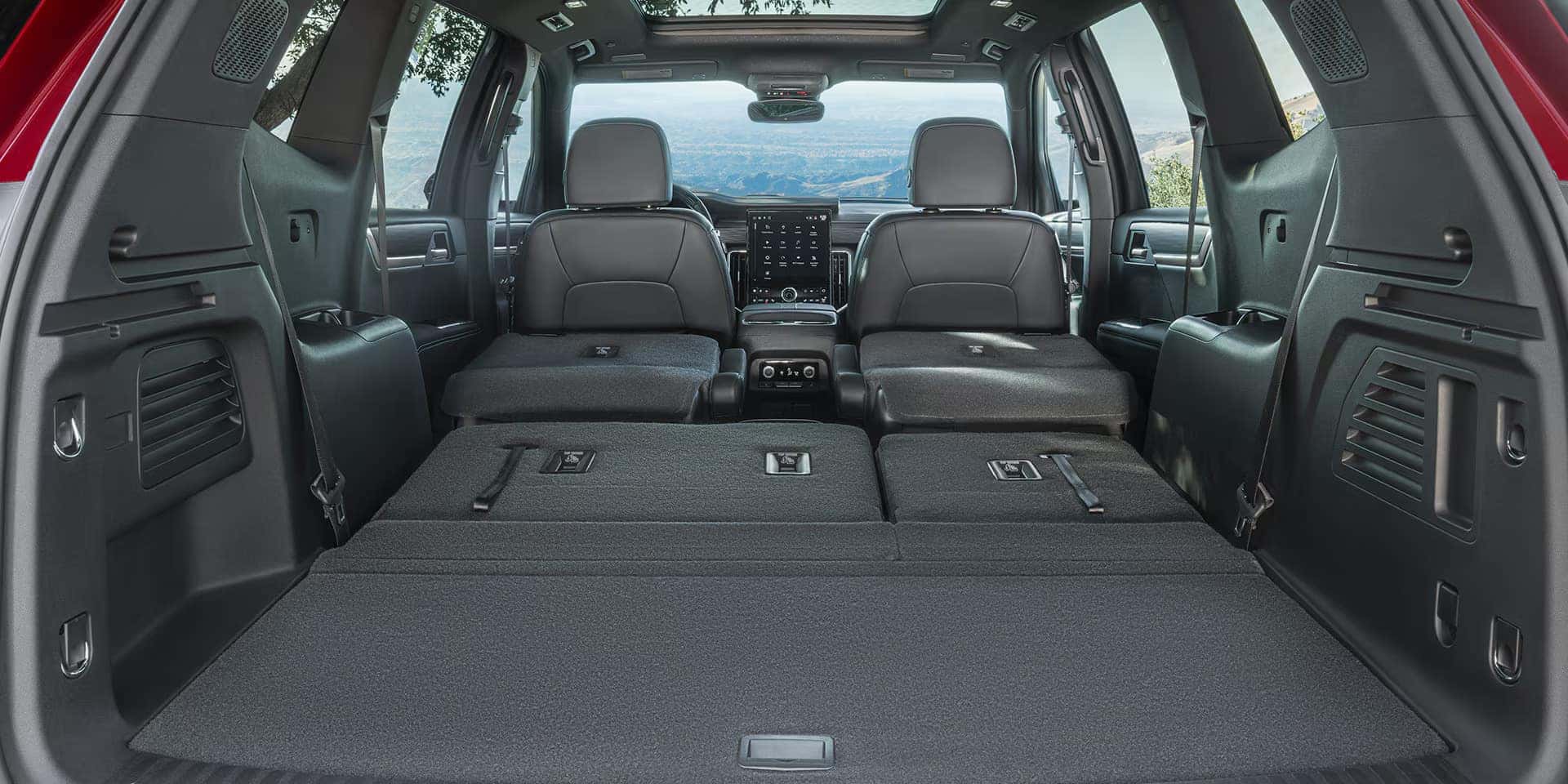 2026 GMC Acadia three-row seating and rear cargo area