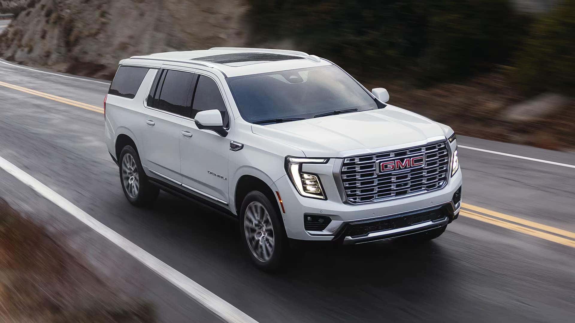 2026 GMC Yukon Denali Ultimate driving on the highway