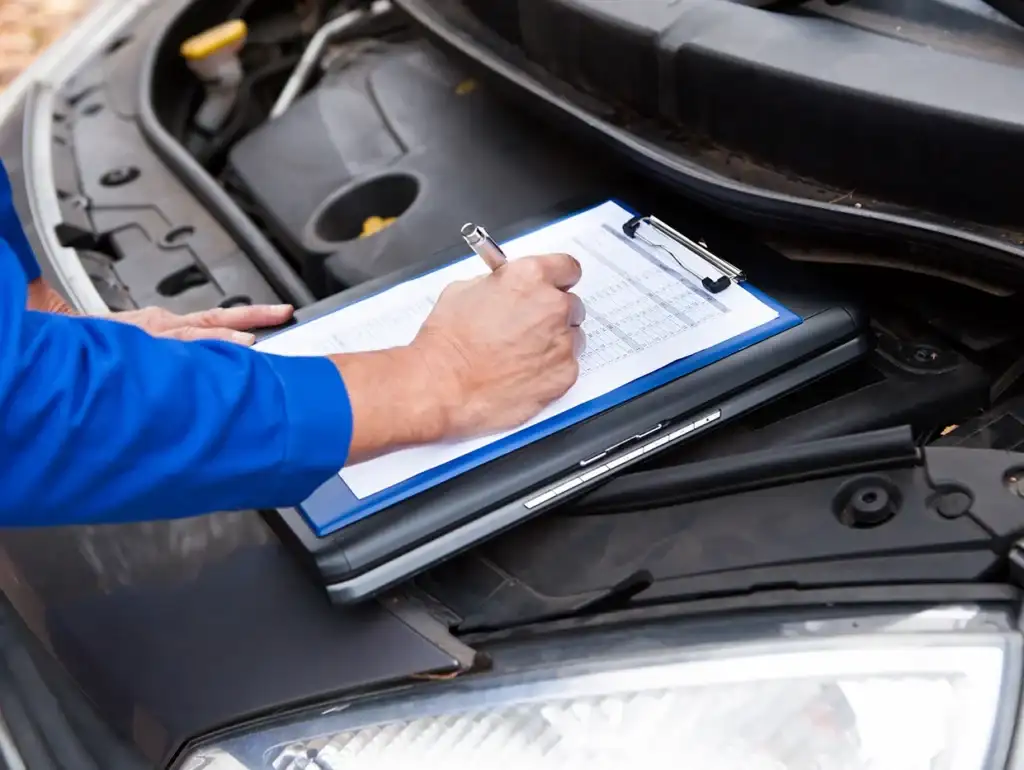 A service tech inspection on a vehicle.