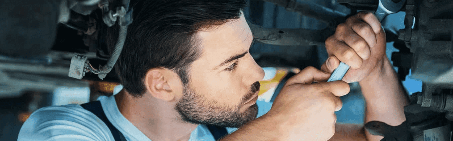 Service Center Certified Mechanic Working On A Vehicle