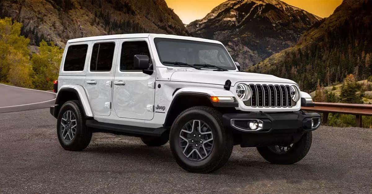 2025 Jeep Wrangler parked in Front of a rocky mountain
