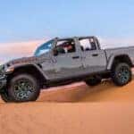 2025 Jeep Gladiator stretched over sand dunes