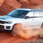 2025 Jeep Grand Cherokee Driving on a Red Dirt Path in ht e Desert