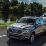 2024 Ram 1500 towing a boat near a lake