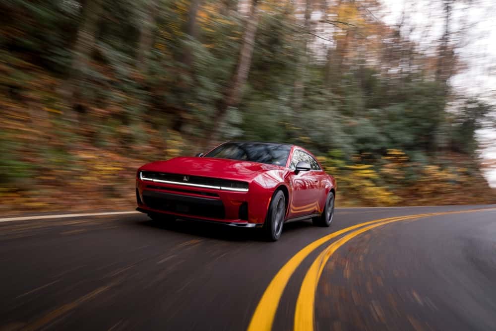 Dodge Charger driving on a tree-lined Central Florida road near Lake Wales
