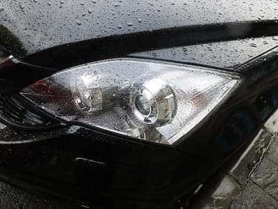 A headlight of a Honda vehicle after headlight replacement in Marion, IL