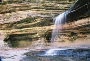 Water flows through a waterfall at Starved Rock near Marion, IL