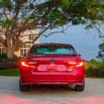 A Honda Accord's rear headlights flash red