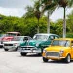 A lineup of four vintage vehicles ready for a car show in Marion, Illinois