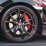 Shot of Honda sports car wheel and rims.