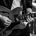 A musician plays the guitar at a concert in Marion, Illinois