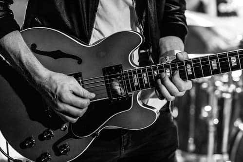 A musician plays the guitar at a concert in Marion, Illinois
