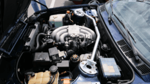Close up of a open honda front hood exposing the engine bay.