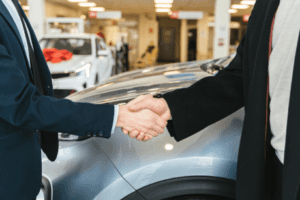 Two men shaking hands after leasing a new Honda in Marion, IL.