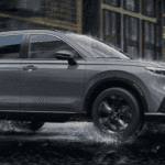 2026 Honda CR-V Hybrid driving through rainy weather road conditions.