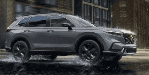 2026 Honda CR-V Hybrid driving through rainy weather road conditions.