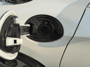 Close up ona white honda vehicle hybrid charging port.