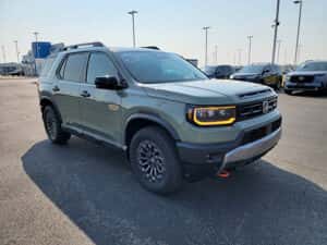 matte green 2026 Honda Passport SUV parked at the Ike Honda Honda dealership in Marion, IL