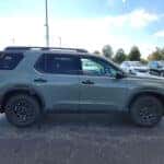 green 2026 Honda Passport SUV parked at the Ike Honda dealership in Marion, IL