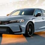 gray 2026 Honda Civic Type R sedan driving down the road