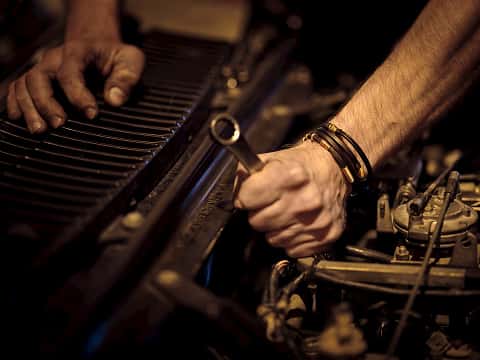 mechanic working on a car