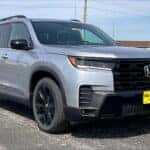 gray 2026 Honda Pilot SUV parked at the Ike Honda dealership in Marion, IL