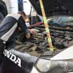 Honda maintenance tech working on a vehicle at the Ike Honda service center in Marion, IL