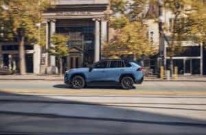 Blue Toyota driving 